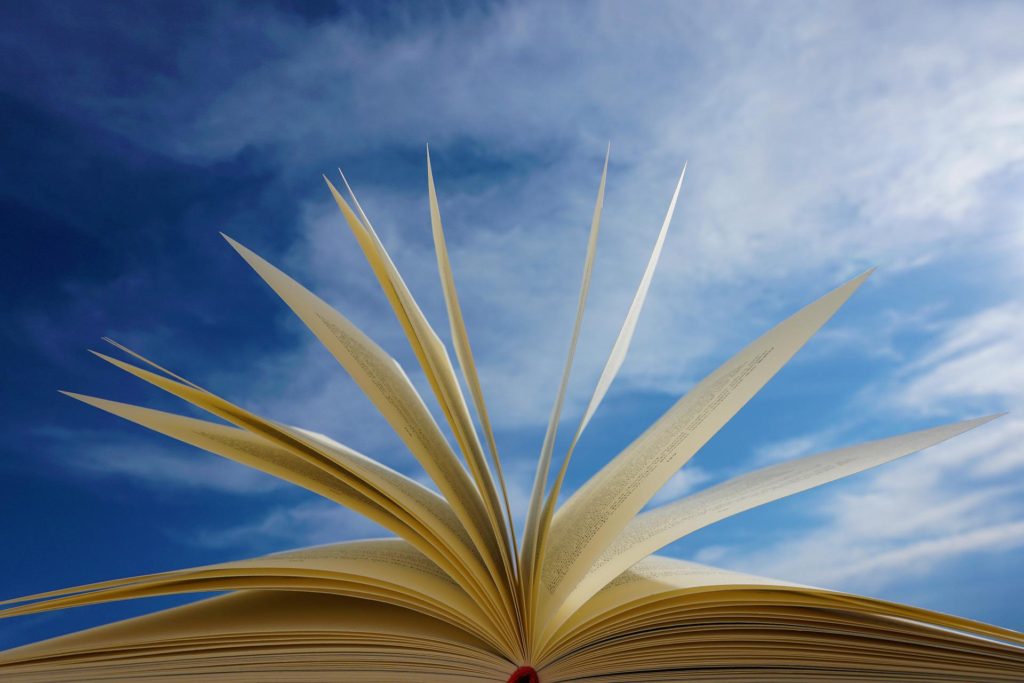 open book with blue sky